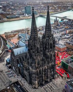 an aerial view of the cathedral in cologne, germany with its spires towering over the city