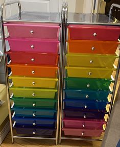 the multicolored drawers are stacked on each other
