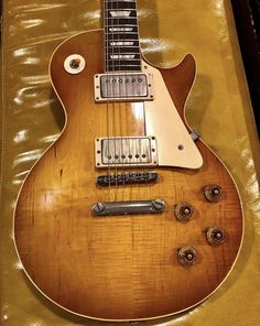 an electric guitar sitting on top of a table