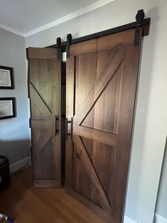 two wooden doors are open in a room