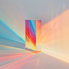 an abstract photo with the colors of rainbow and blue in it's center, against a white background