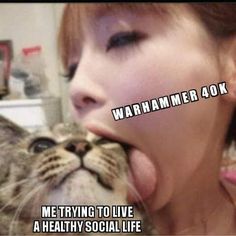 a woman is kissing a cat with the caption saying, warming to live a healthy social life