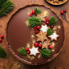 a chocolate tart decorated with christmas decorations