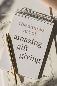 a notepad with the words the simple art of amazing gift giving written on it