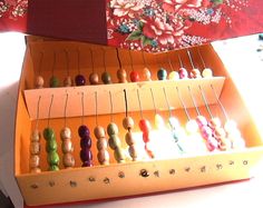 an abacus is sitting on top of a table with other abacus in it