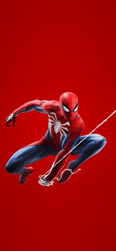 a spider - man flying through the air on a red background