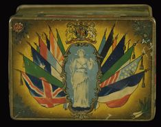 an old tin box with flags and a lady on it