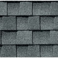 a gray roof with black shingles