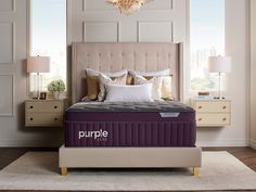 the purple mattress is on display in front of a chandelier and two nightstands