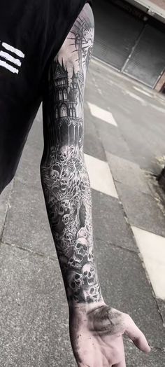 a man with a tattoo on his arm and hand