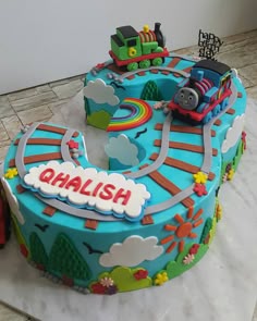 a birthday cake that is shaped like a train