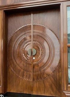 a wooden door with a circular design on it