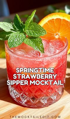 a drink with oranges and mint on the side