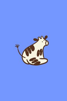 a brown and white cow sitting on top of a blue background
