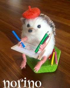 a toy hedgehog with crayons on it's back