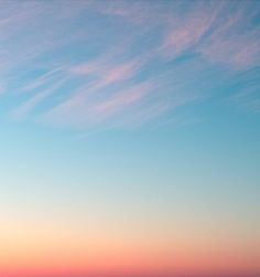 the sky is pink and blue with some clouds