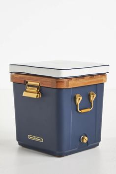 a blue and white cooler sitting on top of a table