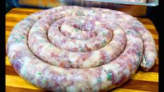 some kind of sausage sitting on top of a cutting board