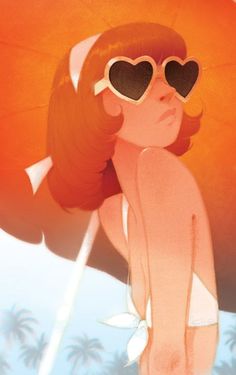 a woman wearing heart shaped sunglasses on the beach