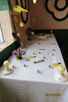 the table is covered with many objects and paper streamers on it's sides