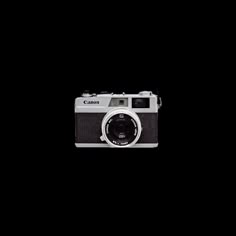 an old camera is shown against a black background