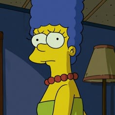the simpsons with blue hair is sitting in front of a lamp and looking at something