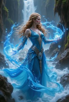 a woman in a blue dress standing next to a waterfall