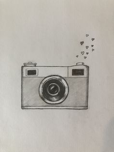 a drawing of a camera with hearts coming out of the lens and shooting at it