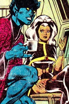 an image of a man and woman in the kitchen with one holding a cup while another holds