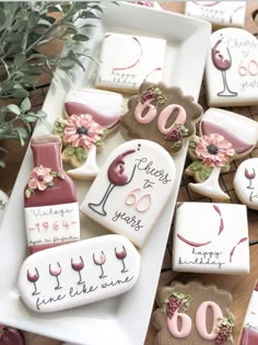 decorated cookies with wine glasses and flowers on them