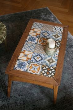 a small table with a candle on it