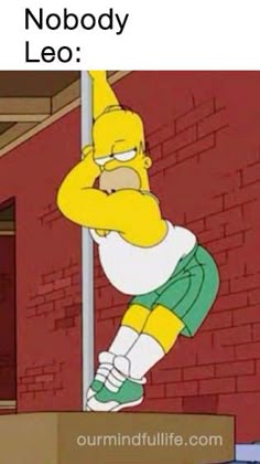 the simpsons standing on top of a box in front of a brick wall and wearing green shorts