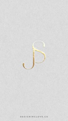 the letter j is made up of gold foil on a light gray background with white lettering