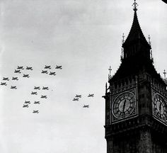 a black and white photo of the big ben clock tower with nine jets flying overhead