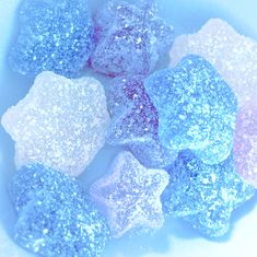 blue and pink sugar cubes sitting on top of each other