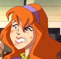 an animated image of a woman with red hair