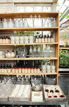 a shelf filled with lots of different types of cakes and desserts on top of it