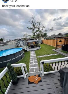 an above ground swimming pool in a backyard with grass and wooden decking, surrounded by landscaping