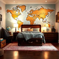 a bedroom with a large map on the wall above the bed and suitcases in front of it
