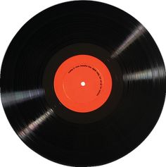 an orange and black record on a white background