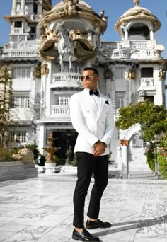 Luxury White Spring Tuxedo, White Suit Men Wedding Classy, White Suit Black Pants Men Wedding, White Suit With Black Pants Men, Ivory And Black Suit Groom, White Blazer Tuxedo Men, White Suit Black Pants Men, Double Breasted White Tuxedo, White Double-breasted Tuxedo For Semi-formal Occasions