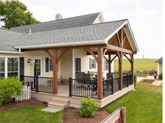 a small house with a covered porch and patio
