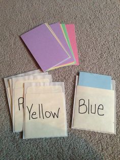 three pieces of paper with words on them sitting on the floor next to each other