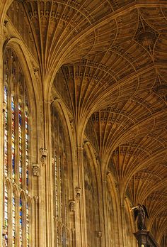 the interior of a cathedral with stained glass windows