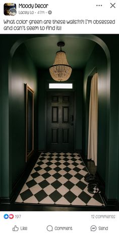 an image of a hallway with green walls and checkered tile on the floor in black and white