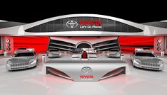 several cars are on display in front of a toyota sign