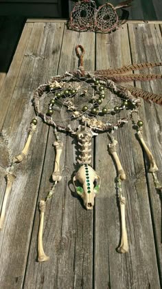 a wooden table topped with a skeleton and other items