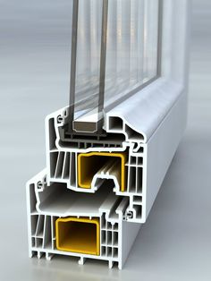 an image of a window frame with yellow and white sections on the outside side, in front of a grey background
