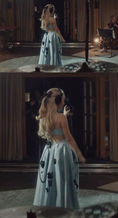 the back of a woman in a blue dress