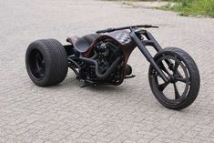 an unusual looking motorcycle is parked on the street
